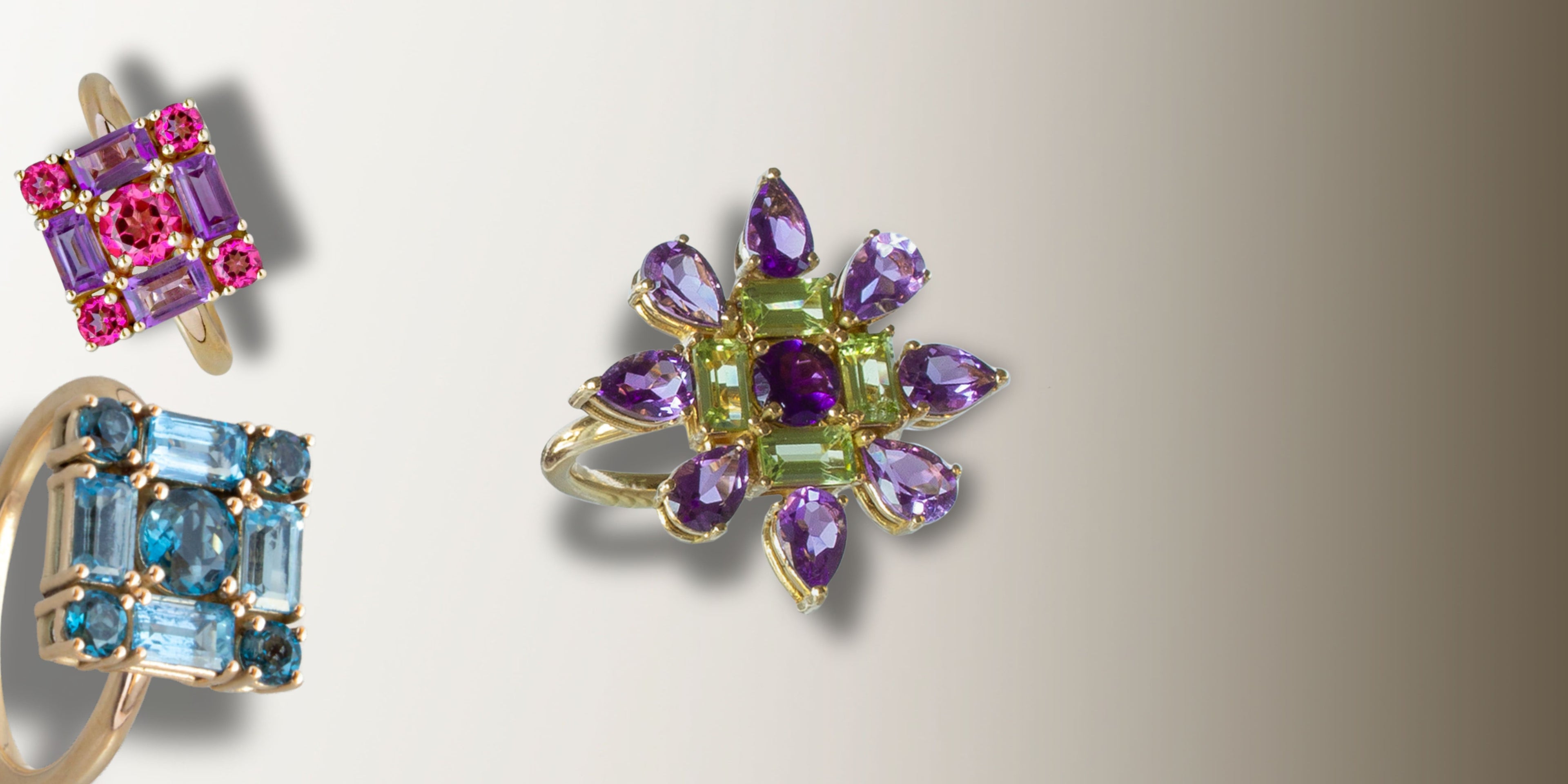 Anillo de oro amarillo con forma de estrella cuajada de amatistas y peridotos.