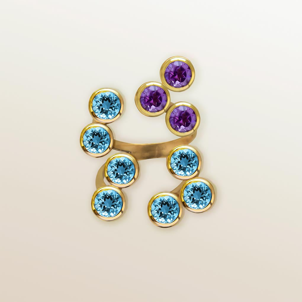 Anillo de Oro Vermeil amarillo, 7 topacios azules y 3 amatistas naturales talladas en forma de brillante.