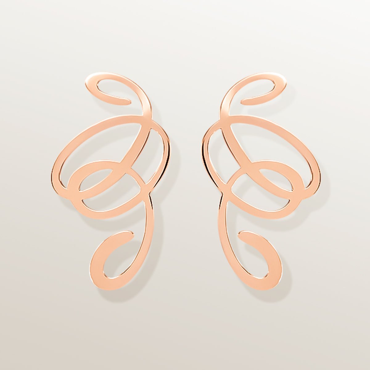 Pendientes de oro Vermeil rosa. Diseño calado de un sólo trazo formando un laberinto, cortado a láser y terminado a mano.